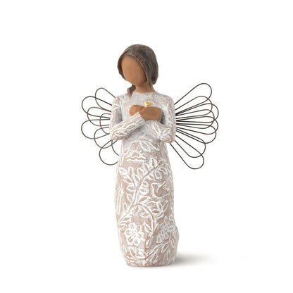 Close-up_of_Willow_Tree_Remembrance_Angel_darker_skin_with_carved_memory_symbols