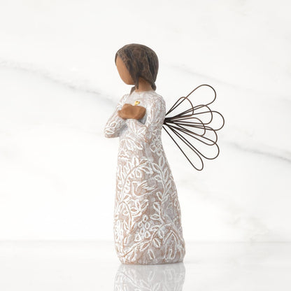 Other_Side_view_of_Willow_Tree_Remembrance_Angel_darker_skin_figurine_holding_a_gold_heart